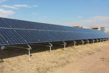 pv_lifetime_graphic_2a Photo of blue solar panels mounted on the ground.