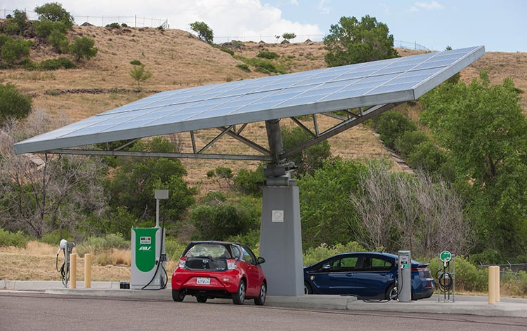project-vto-39246 Two electric vehicles parked under a PV canopy.