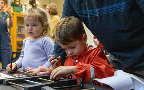 Two kids engaged in hands-on learning activities.