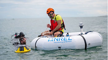 20241114-newsletter-riskmanagement-sm NREL researcher on a wave energy converter