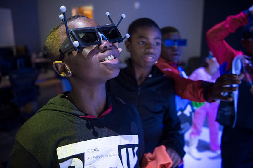Children experience the 3-D Visualization Lab.