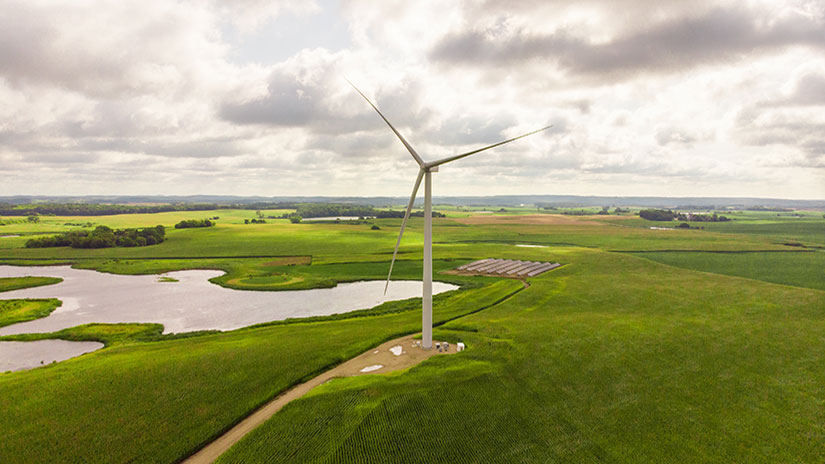 202403-lake-region-electric-cooperative A wind turbine in a grassy field.