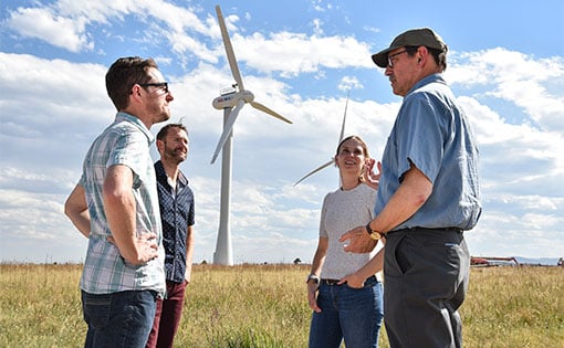 tap-engagement-53318 Researchers chatting outside at NREL’s Flatirons campus.