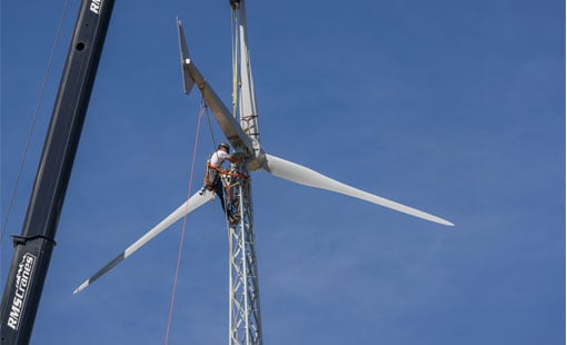 windwatts-wind-turbine Person working on wind turbine