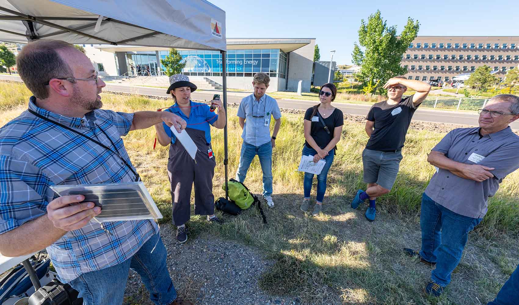 work-with-us-83355 A group listens to a tour guide at the National Renewable Energy Laboratory