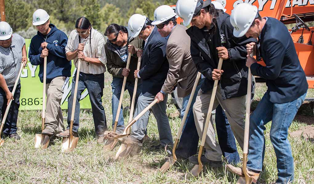 workforce-community-industry-engagement-64847-tn Group of people stand holding shovels to start digging in the ground.