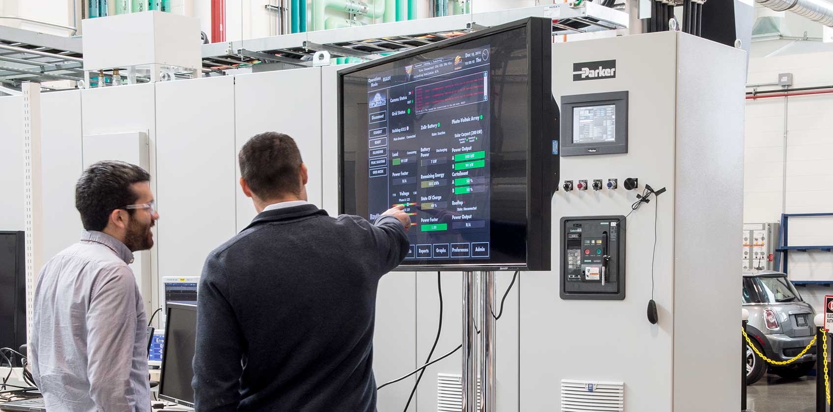 hero-32580_lg Two scientists pointing at a computer screen in a laboratory.