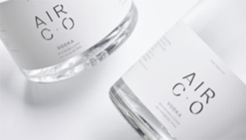 Two clear bottles labeled Air CO Vodka