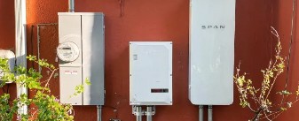 Three electricity panels, one with a meter (left) and another labeled "SPAN" (right).
