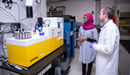 Researchers perform fuel analyses in a lab