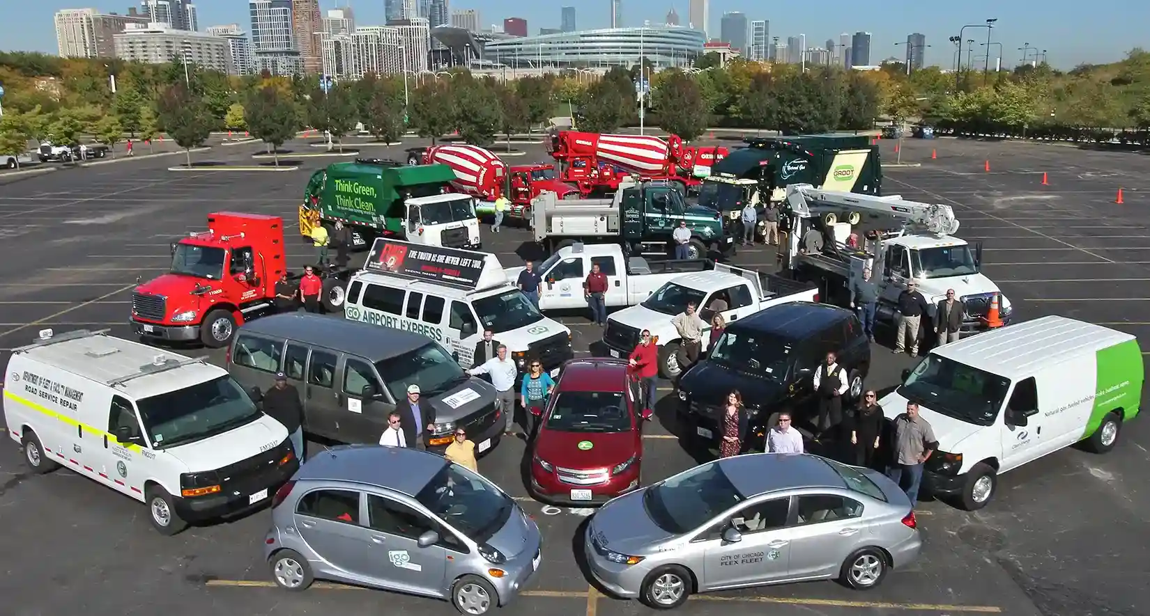 deployment-hero-42821 People standing within circles of a variety of different vehicle types.