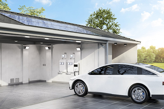 winter24-getty-1526548489 White car plugged in to a charger in a garage with solar panels.