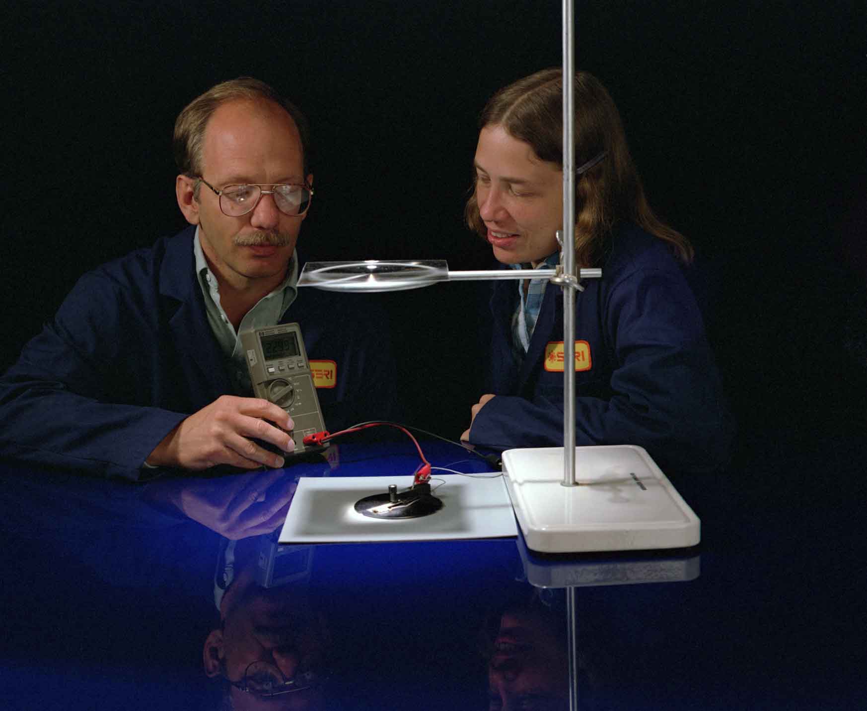 A man and woman conduct an experiment.