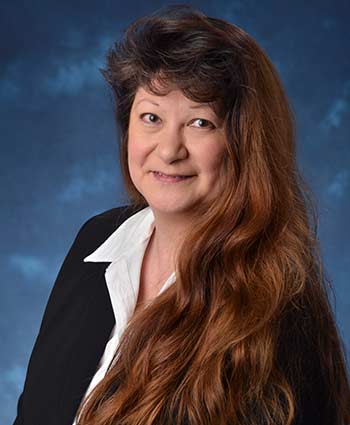 Studio head shot of Ellen Edwards.