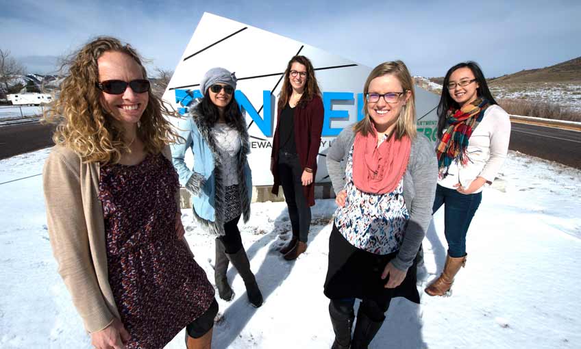 5 women stand in front of NREL Golden Campus sign