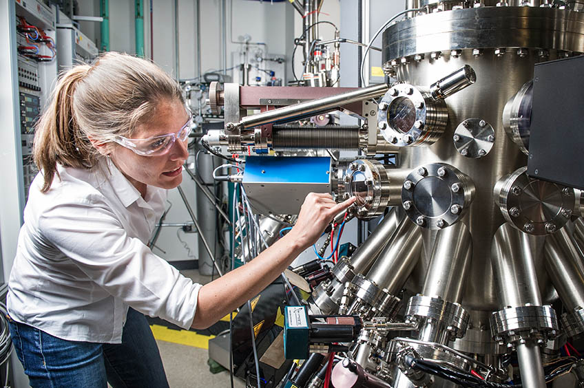 A researcher working with equipment in the lab.