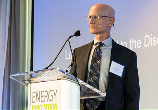 NREL Energy Security and Resilience Center Director John Barnett stands at podium during 2019 Partner Forum at NREL.