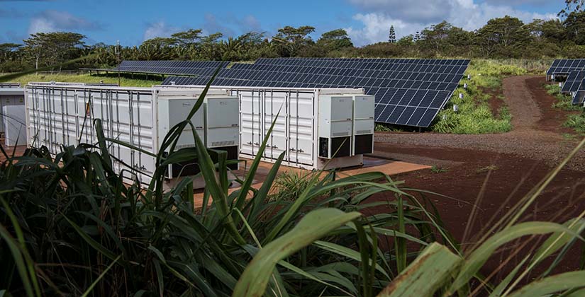 AES Lawai Solar Project in Kauai showing solar panels and energy storage units.