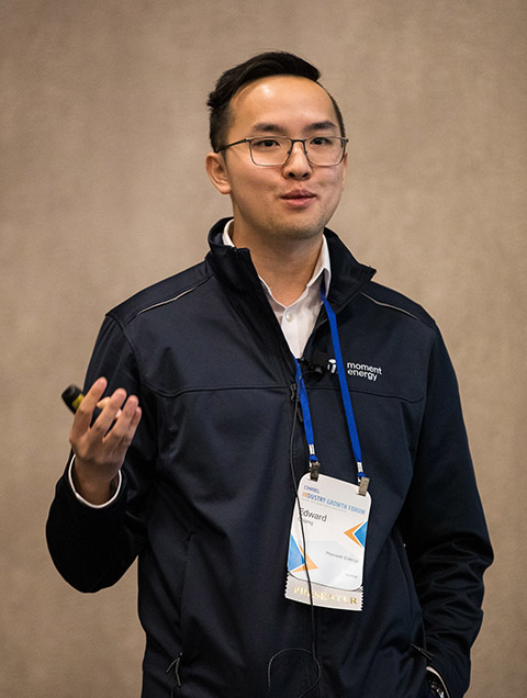 Photo of a person presenting information to an audience