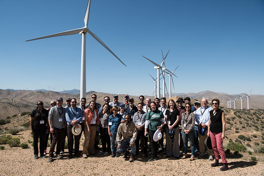 Photo of a group of people touring a wind and solar farm in Los Angeles.