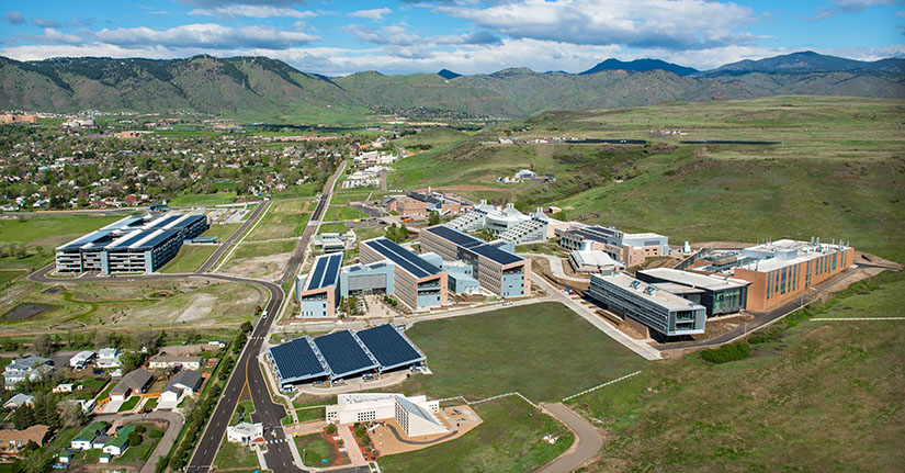 Aerial photo of NREL's South Table Mountain Campus with mountains and neighborhoods in background