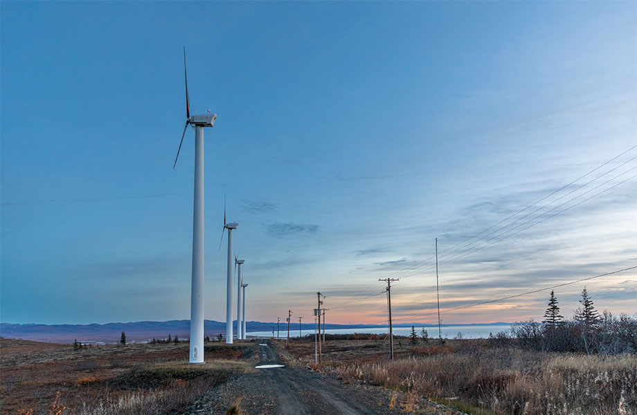 Wind turbines along the coast at sunset