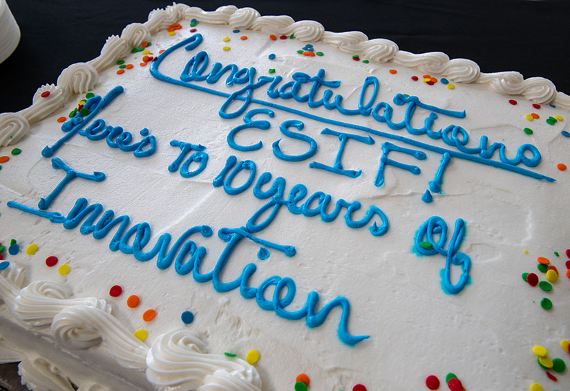 A cake with "Congratulations ESIF! Here's to 10 years of Innovation" written in icing.