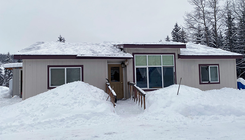 Photo of a home covered in snow