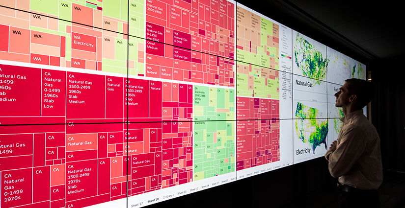 A person looks at a computer screen in a visualization lab.