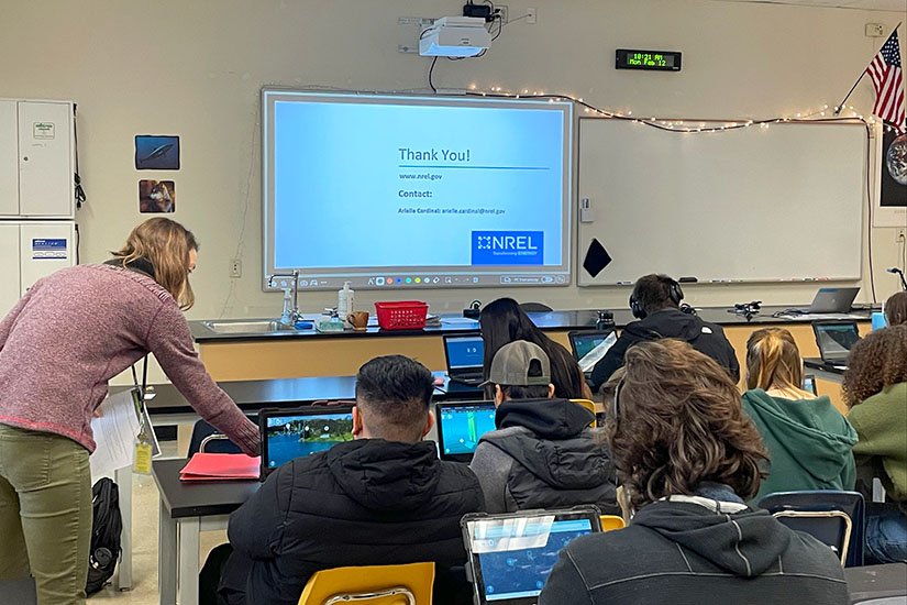 A teacher working with students in a classroom