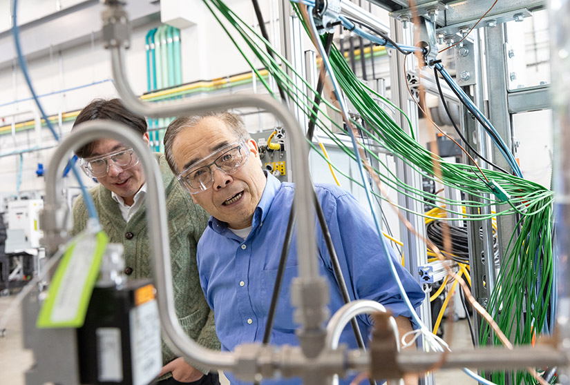 Two people working in a lab.