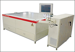 Photo of the new solar simulator, a low, wide rectangular white cabinet with a flat shiny surface. Connected to the cabinet are a computer monitor, keyboard, and a hard drive.