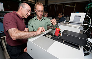 Photo of two men in a lab.