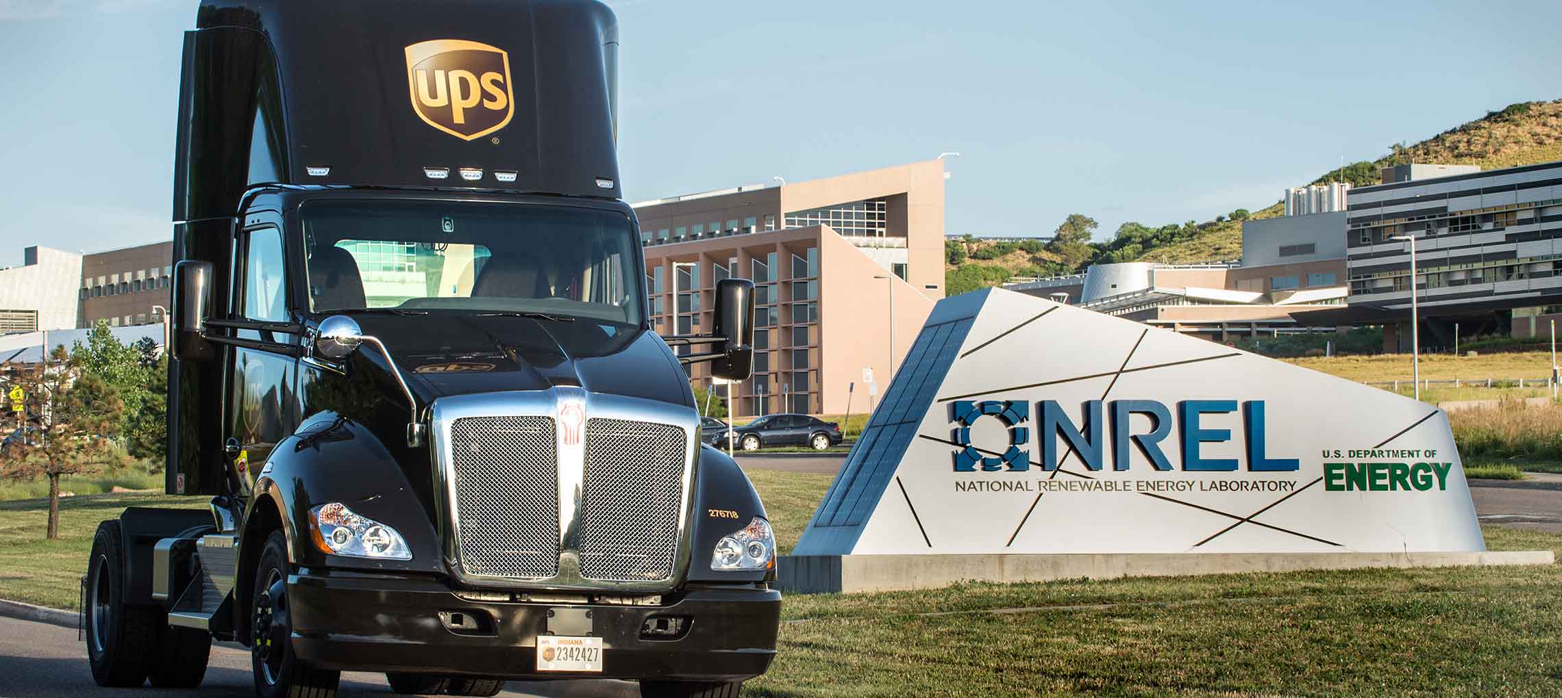 Photo of a UPS heavy-duty truck by the NREL entrance sign.