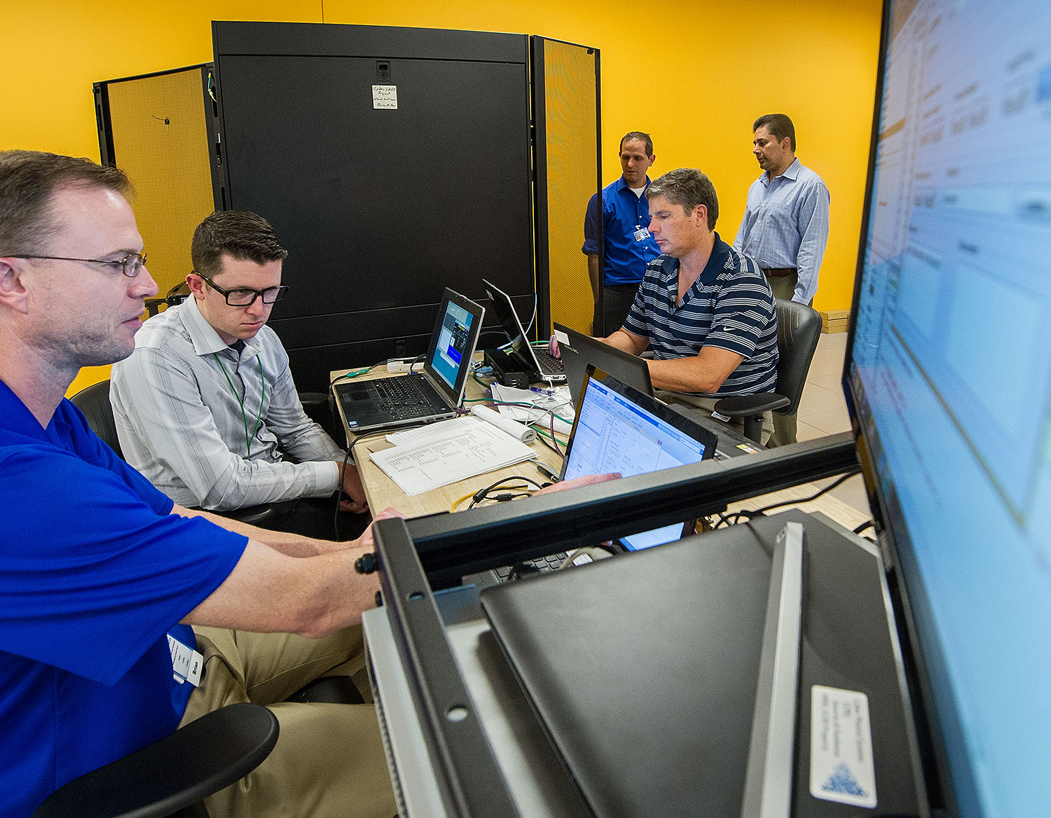 Photo of a group of people working on computers