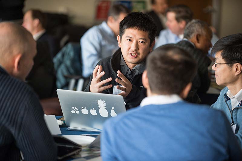 Photo of NREL researchers talking.