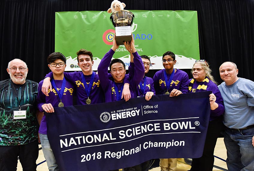 The Ft. Collins science bowl team and coaches celebrate their win.