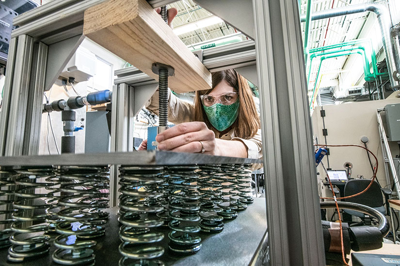 A woman conducts an experiment involving thermal energy storage.