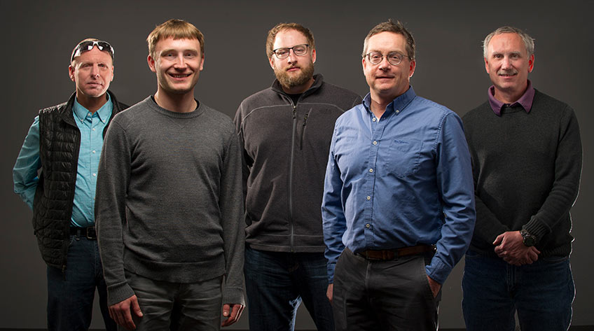 Studio photo of five scientists