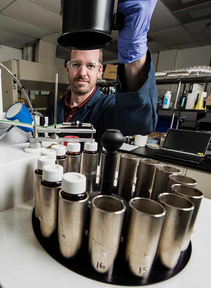 A researcher analyzes fuel samples in the National Renewable Energy Laboratory’s Fuels Lab.