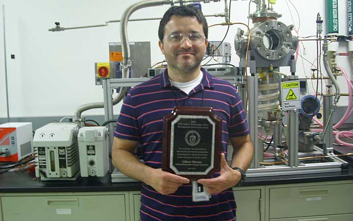 Man holds award