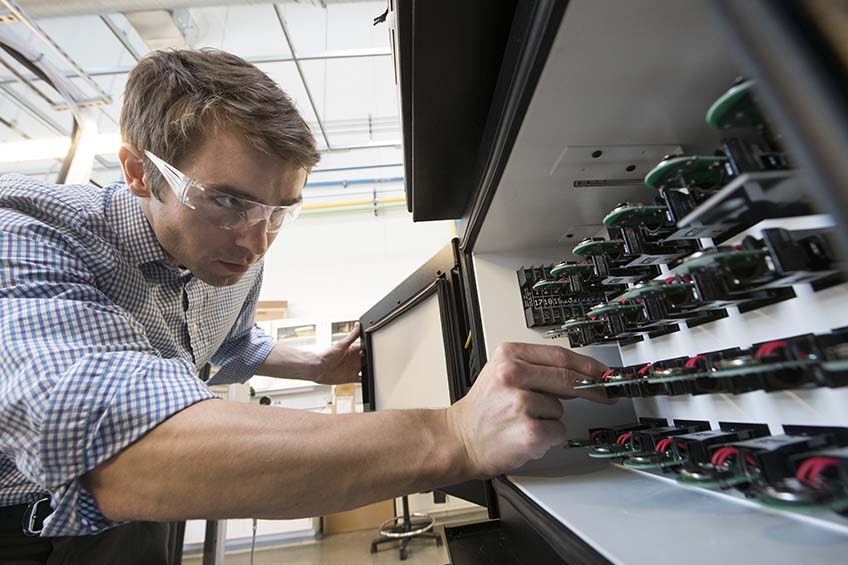 Photo of researcher working in laboratory setting.