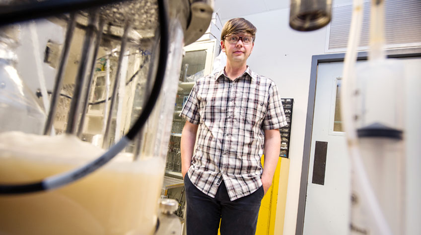 Photo of a man standing in a laboratory.