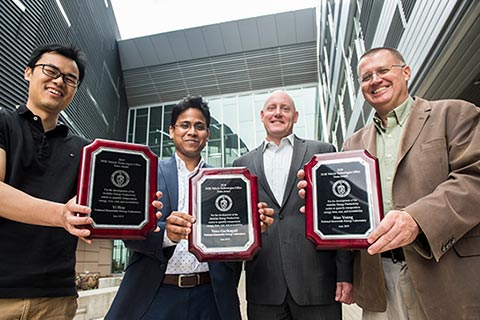 Photo of people holding awards