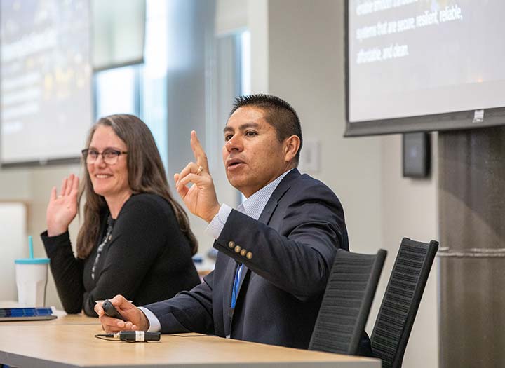 Photo of Sheila Hayter and Juan Torres sitting at a table