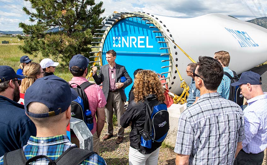 People stand outside as part of a tour.