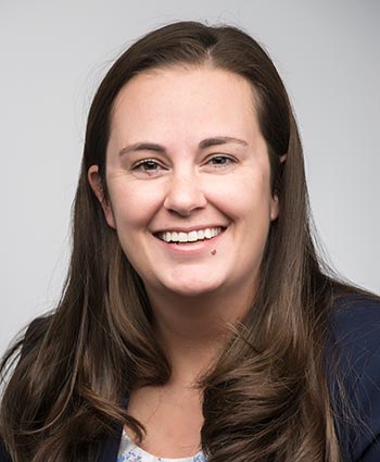 A women smiling for the camera.