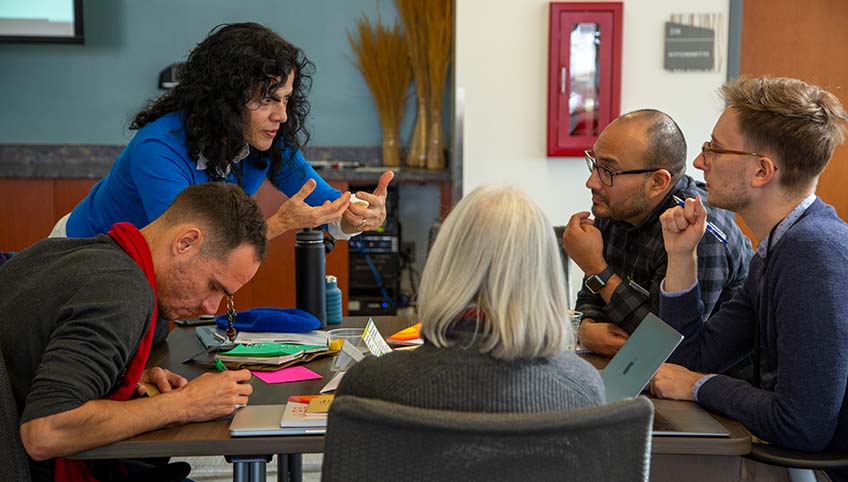 A group of people working together at the workshop.