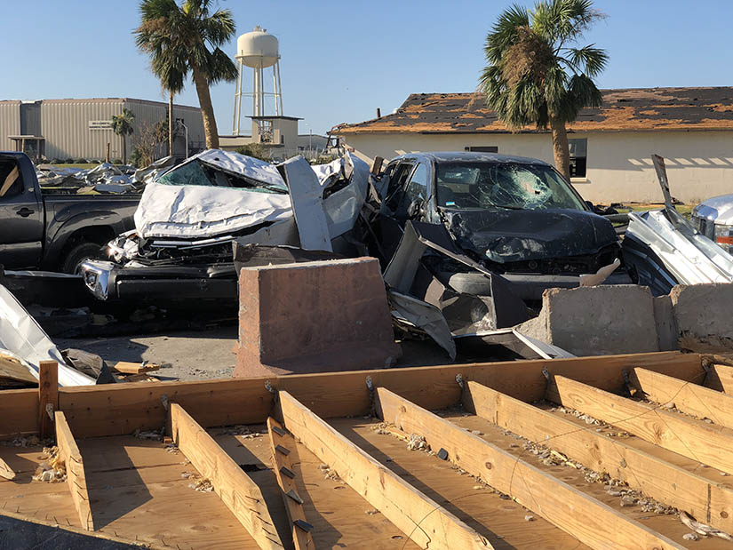 Parked vehicles damaged after a hurricane strike