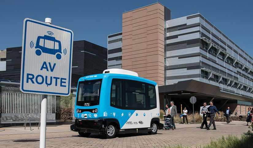 An automated electric vehicle makes a lap around the NREL campus. 